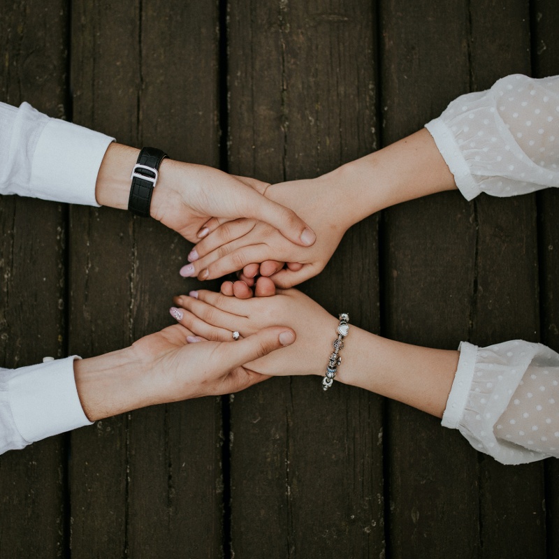 Therapist holding patients hands