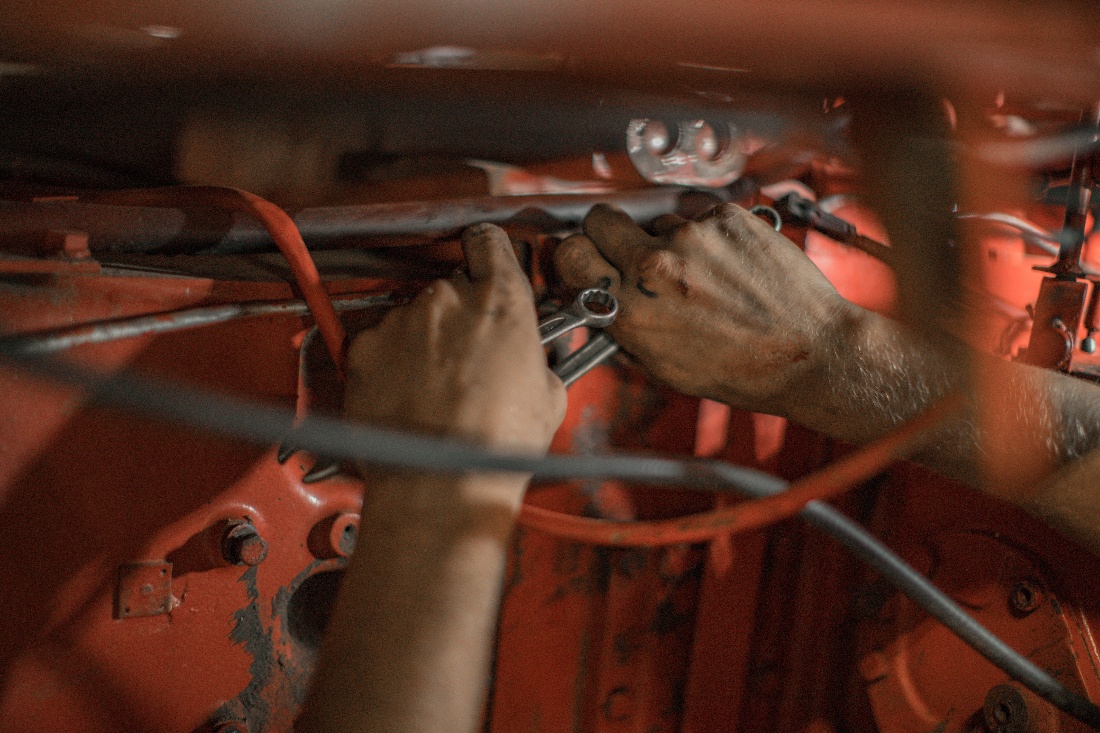 mechanic working on vehicle